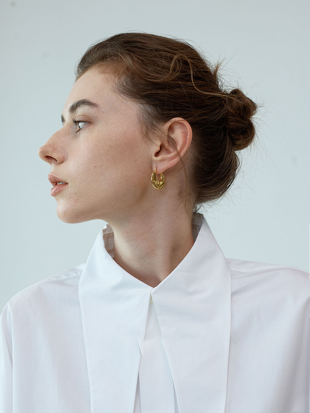 Gold Pinched Sculptural Huggie Hoops
